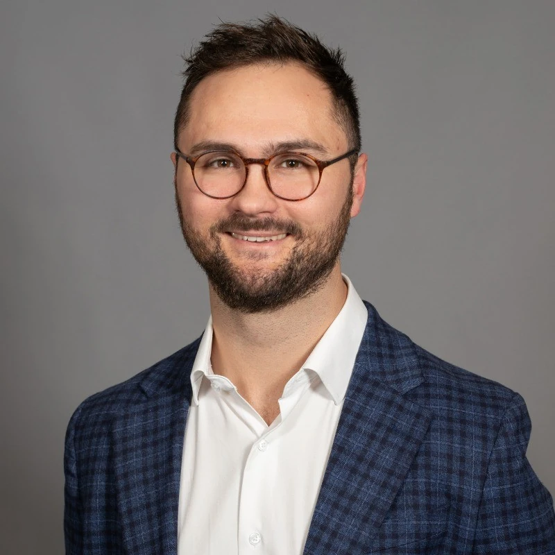 Portrait of Christopher Benassi, healthcare and medtech executive.